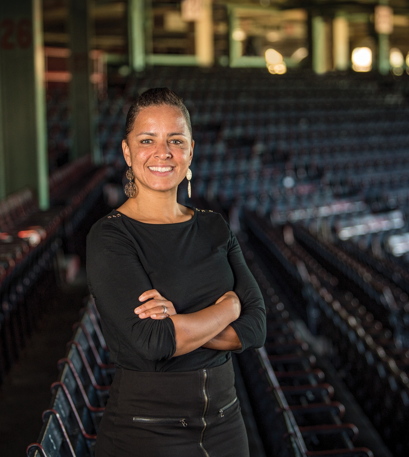 Photograph of Rebekah Splaine Salwasser &rsquo;01 standing in the Boston Red Sox stadium